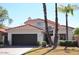 Cute two-story home with tile roof and landscaped lawn at 9573 E Dreyfus Pl, Scottsdale, AZ 85260