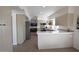 Updated kitchen featuring white shaker cabinets and expansive countertops at 9573 E Dreyfus Pl, Scottsdale, AZ 85260