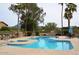 Community pool with plenty of lounge chairs and mountain views at 9573 E Dreyfus Pl, Scottsdale, AZ 85260