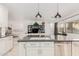 Modern kitchen with island, stainless steel appliances, and white cabinets at 9835 N Desert Rose Dr, Fountain Hills, AZ 85268