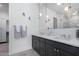 Double vanity bathroom with marble countertops and modern fixtures at 12451 E Troon Vista Dr, Scottsdale, AZ 85255