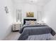 Charming bedroom with gray bedding and stylish nightstands at 12451 E Troon Vista Dr, Scottsdale, AZ 85255