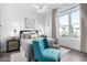 Bright bedroom with large window and comfortable seating at 12451 E Troon Vista Dr, Scottsdale, AZ 85255