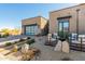 Stunning desert landscaping enhances this contemporary home's curb appeal at 12451 E Troon Vista Dr, Scottsdale, AZ 85255