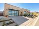 Contemporary home exterior showcasing a clean design and spacious driveway at 12451 E Troon Vista Dr, Scottsdale, AZ 85255