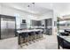 Modern kitchen with stainless steel appliances and a large island at 12451 E Troon Vista Dr, Scottsdale, AZ 85255