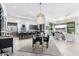 Open-concept kitchen with modern cabinetry, island, and breakfast area at 12451 E Troon Vista Dr, Scottsdale, AZ 85255
