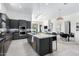 Open concept kitchen featuring a marble island and breakfast bar at 12451 E Troon Vista Dr, Scottsdale, AZ 85255