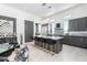Modern kitchen with sleek cabinetry, expansive island, and high-end appliances at 12451 E Troon Vista Dr, Scottsdale, AZ 85255