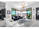 Spacious living room features a comfortable seating area and sliding glass doors at 12451 E Troon Vista Dr, Scottsdale, AZ 85255