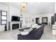 Elegant living room boasts a fireplace, large windows, and ample natural light at 12451 E Troon Vista Dr, Scottsdale, AZ 85255