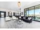 Bright and airy living room with modern decor and access to backyard patio at 12451 E Troon Vista Dr, Scottsdale, AZ 85255