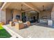 Covered patio with comfortable seating and outdoor kitchen at 12451 E Troon Vista Dr, Scottsdale, AZ 85255