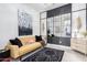 Relaxing sitting area with mustard sofa and large mirror at 12451 E Troon Vista Dr, Scottsdale, AZ 85255