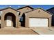 Single-story house with a two-car garage and neutral color scheme at 13156 E Verbina Ln, Florence, AZ 85132