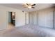 Bedroom with ceiling fan, carpet, and lots of closet space at 14637 N Olympic Way, Fountain Hills, AZ 85268