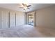 Bedroom with ceiling fan, carpet, and sliding glass door to patio at 14637 N Olympic Way, Fountain Hills, AZ 85268