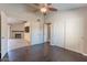 Bedroom with ceiling fan, dark wood floors, and access to living room at 14637 N Olympic Way, Fountain Hills, AZ 85268