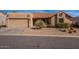 Single-story home with a two-car garage and desert landscaping at 14637 N Olympic Way, Fountain Hills, AZ 85268