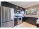 Modern kitchen with stainless steel appliances and breakfast bar at 14637 N Olympic Way, Fountain Hills, AZ 85268