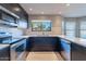 Modern kitchen with stainless steel appliances and dark wood cabinets at 14637 N Olympic Way, Fountain Hills, AZ 85268
