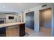 Eat-in kitchen with island, stainless steel appliances, and dark wood cabinets at 14637 N Olympic Way, Fountain Hills, AZ 85268