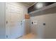 Convenient laundry area with storage cabinets and exterior access at 14637 N Olympic Way, Fountain Hills, AZ 85268
