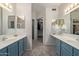 Double vanity bathroom with a walk-in closet at 15225 N 100Th St # 1208, Scottsdale, AZ 85260
