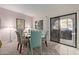 Charming dining area with a glass table and four chairs at 15225 N 100Th St # 1208, Scottsdale, AZ 85260