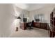 Home office features a large desk, chair, and built-in shelving at 15225 N 100Th St # 1208, Scottsdale, AZ 85260
