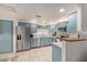 Updated kitchen featuring light blue cabinets and granite countertops at 15225 N 100Th St # 1208, Scottsdale, AZ 85260