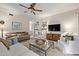 Bright and airy living room featuring comfy furniture and a TV at 15225 N 100Th St # 1208, Scottsdale, AZ 85260