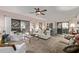 Spacious living room with ample seating and a ceiling fan at 15225 N 100Th St # 1208, Scottsdale, AZ 85260