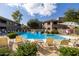 Inviting pool area with lounge chairs and a shaded seating area at 15225 N 100Th St # 1208, Scottsdale, AZ 85260