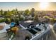 Stunning aerial view of the house, pool, and surrounding neighborhood at 1743 W Butler Dr, Phoenix, AZ 85021
