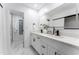 Spa-like bathroom with double vanity, marble floors, and walk-in shower at 1743 W Butler Dr, Phoenix, AZ 85021
