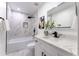 Modern bathroom with marble tile and updated fixtures at 1743 W Butler Dr, Phoenix, AZ 85021