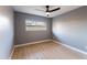 Bright bedroom with wood-look floors and a ceiling fan at 1743 W Butler Dr, Phoenix, AZ 85021