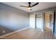 Bright bedroom featuring a large closet and wood-look floors at 1743 W Butler Dr, Phoenix, AZ 85021