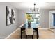 Elegant dining room with a large table and statement lighting fixture at 1743 W Butler Dr, Phoenix, AZ 85021