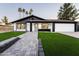 Stunning curb appeal featuring a remodeled home with a paved walkway and lush landscaping at 1743 W Butler Dr, Phoenix, AZ 85021