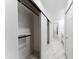 Bright hallway with white sliding doors leading to bathroom and bedrooms at 1743 W Butler Dr, Phoenix, AZ 85021