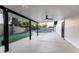 Covered patio overlooks a refreshing pool and grassy backyard at 1743 W Butler Dr, Phoenix, AZ 85021