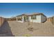 View of private backyard featuring a covered patio and low-maintenance landscaping at 17603 W Superior Ave, Goodyear, AZ 85338