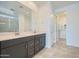 Stylish bathroom with double vanity, stone countertop, and tiled floor for a luxurious feel at 17603 W Superior Ave, Goodyear, AZ 85338