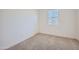 Bedroom with plush carpeting, white walls and a window allowing for natural light at 17603 W Superior Ave, Goodyear, AZ 85338