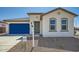 Charming single-story home with a blue garage door, neutral stucco, and tile roof at 17603 W Superior Ave, Goodyear, AZ 85338