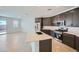 Modern kitchen with stainless steel appliances, a gas range, and large kitchen island at 17603 W Superior Ave, Goodyear, AZ 85338