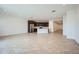 Open-concept living area with tile floors, recessed lighting, and modern stainless-steel appliances at 17603 W Superior Ave, Goodyear, AZ 85338