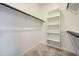 Well-organized walk-in closet with shelving and rods maximizes storage space at 17603 W Superior Ave, Goodyear, AZ 85338